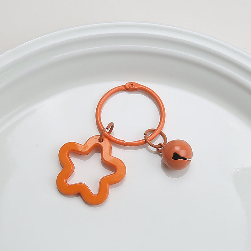 Color five-pointed star acrylic keychain pendant, candy-colored earphone cover pendant, small fresh couple bag decoration.